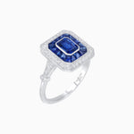Load image into Gallery viewer, Art Deco Inspired Emerald Cut Halo Ring with Calibré Gems