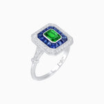 Load image into Gallery viewer, Art Deco Inspired Emerald Cut Halo Ring with Calibré Gems