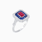 Load image into Gallery viewer, Art Deco Inspired Emerald Cut Halo Ring with Calibré Gems