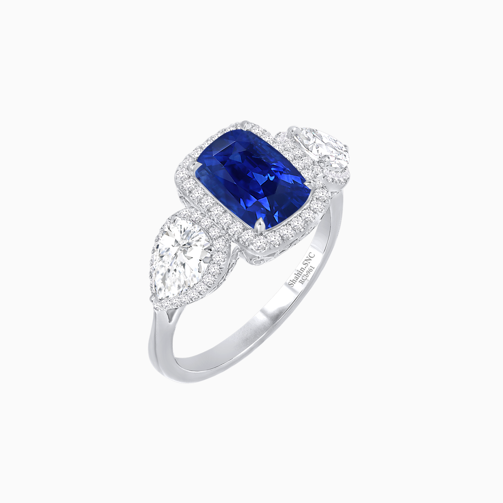 Vintage Inspired Cushion Cut Three-Stone Halo Ring with Pear-Shaped Side Stones
