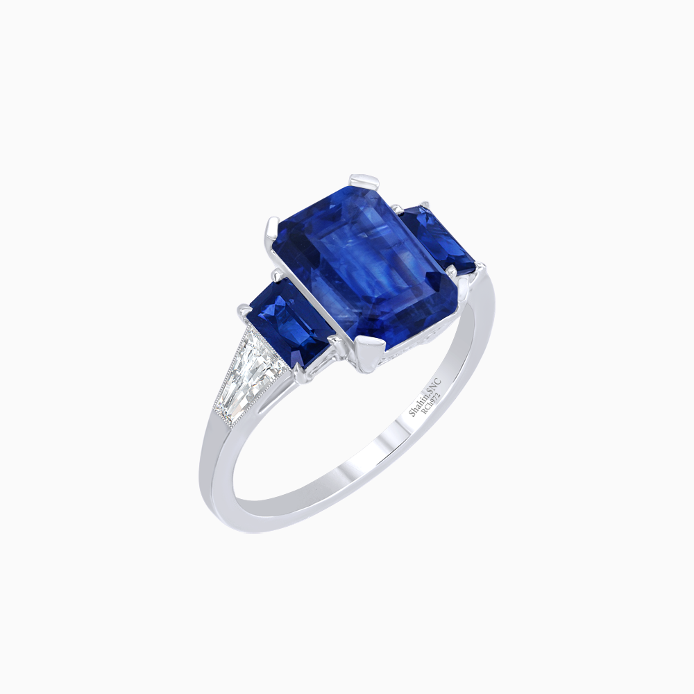 Art Deco Inspired Emerald Cut Three-Stone Ring with Tapered Baguettes