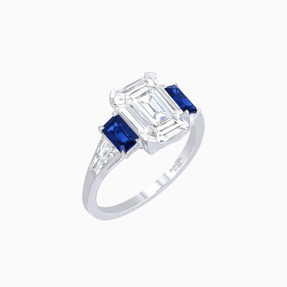 Art Deco Inspired Emerald Cut Three-Stone Ring with Tapered Baguettes