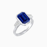 Load image into Gallery viewer, Modern Art Deco Inspired Emerald-Cut Bezel Engagement Ring with Tapered Baguette Side Stones