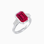 Load image into Gallery viewer, Modern Art Deco Inspired Emerald-Cut Bezel Engagement Ring with Tapered Baguette Side Stones