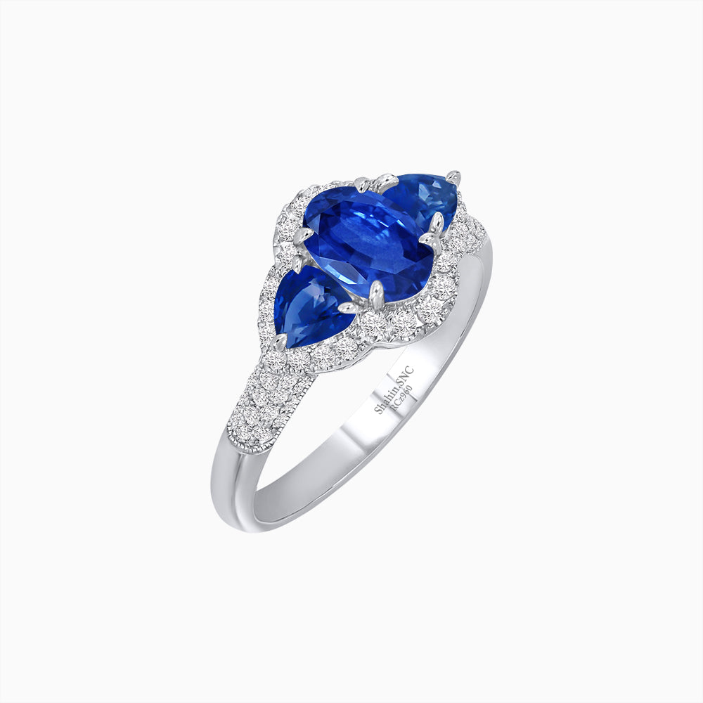 Three-Stone Oval Ring with Pear Shape Side Stones and Diamond Halo