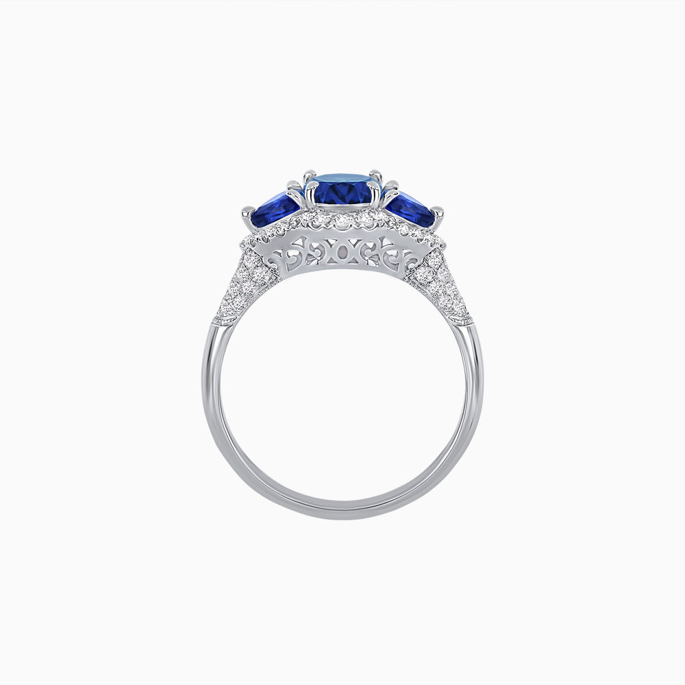 Three-Stone Oval Ring with Pear Shape Side Stones and Diamond Halo