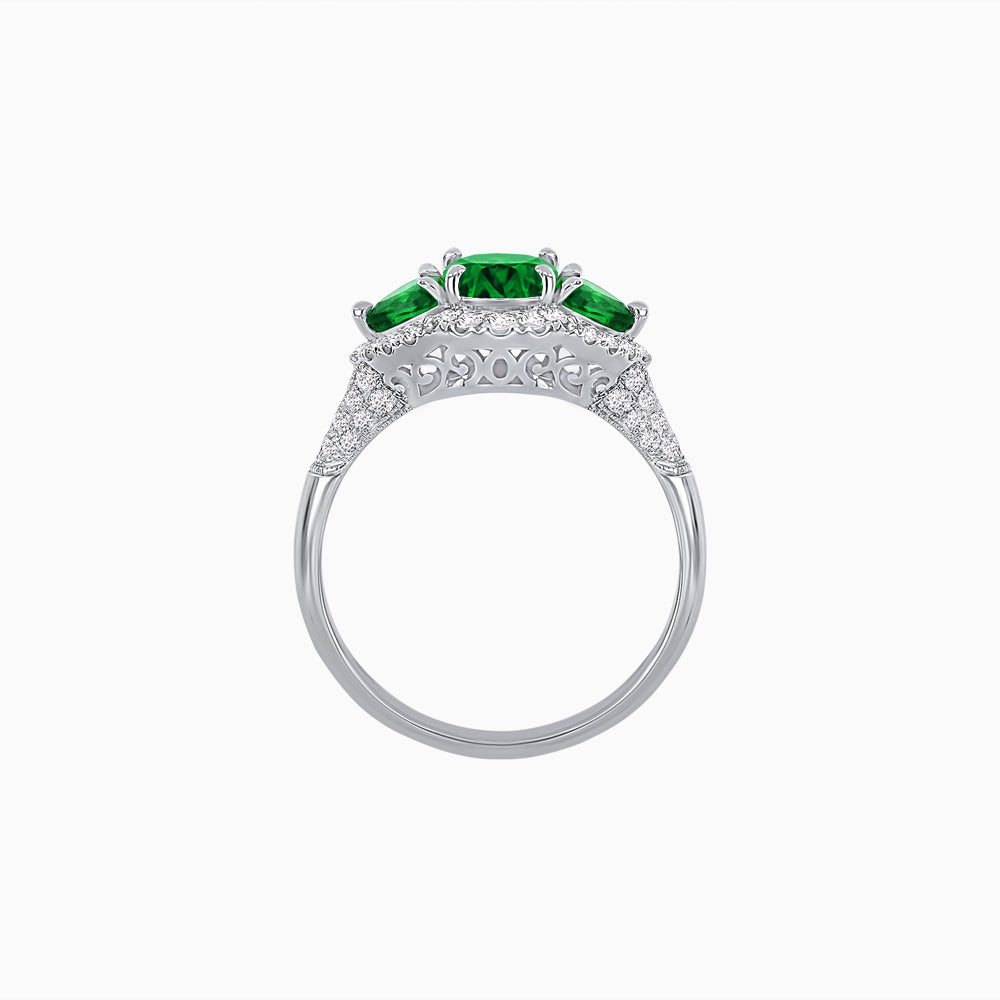 Three-Stone Oval Ring with Pear Shape Side Stones and Diamond Halo