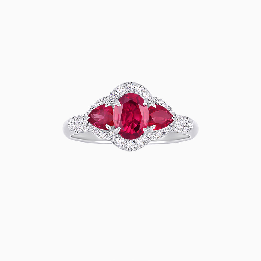 Three-Stone Oval Ring with Pear Shape Side Stones and Diamond Halo
