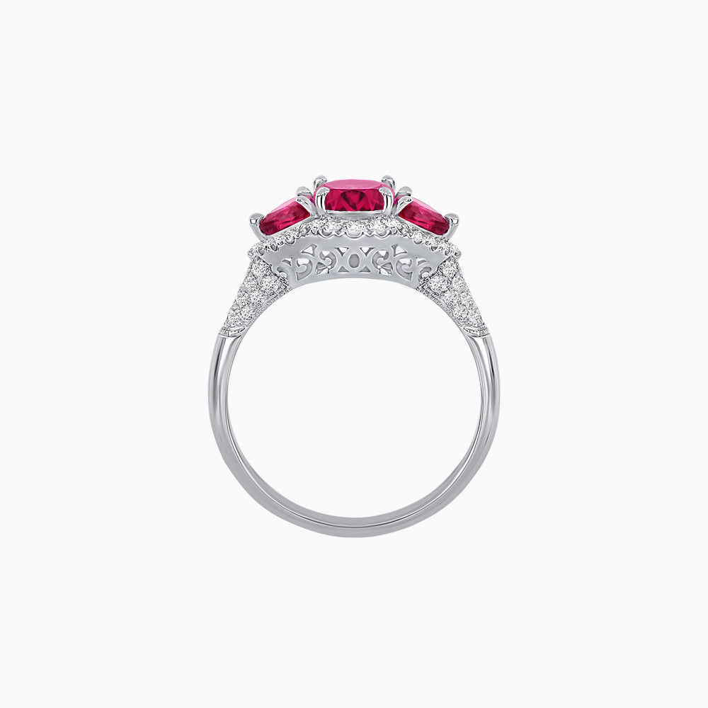 Three-Stone Oval Ring with Pear Shape Side Stones and Diamond Halo