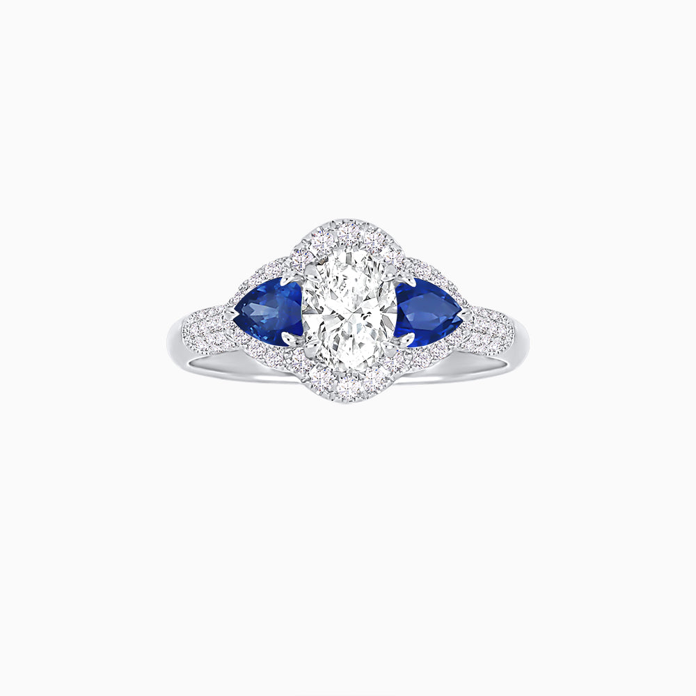 Three-Stone Oval Ring with Pear Shape Side Stones and Diamond Halo