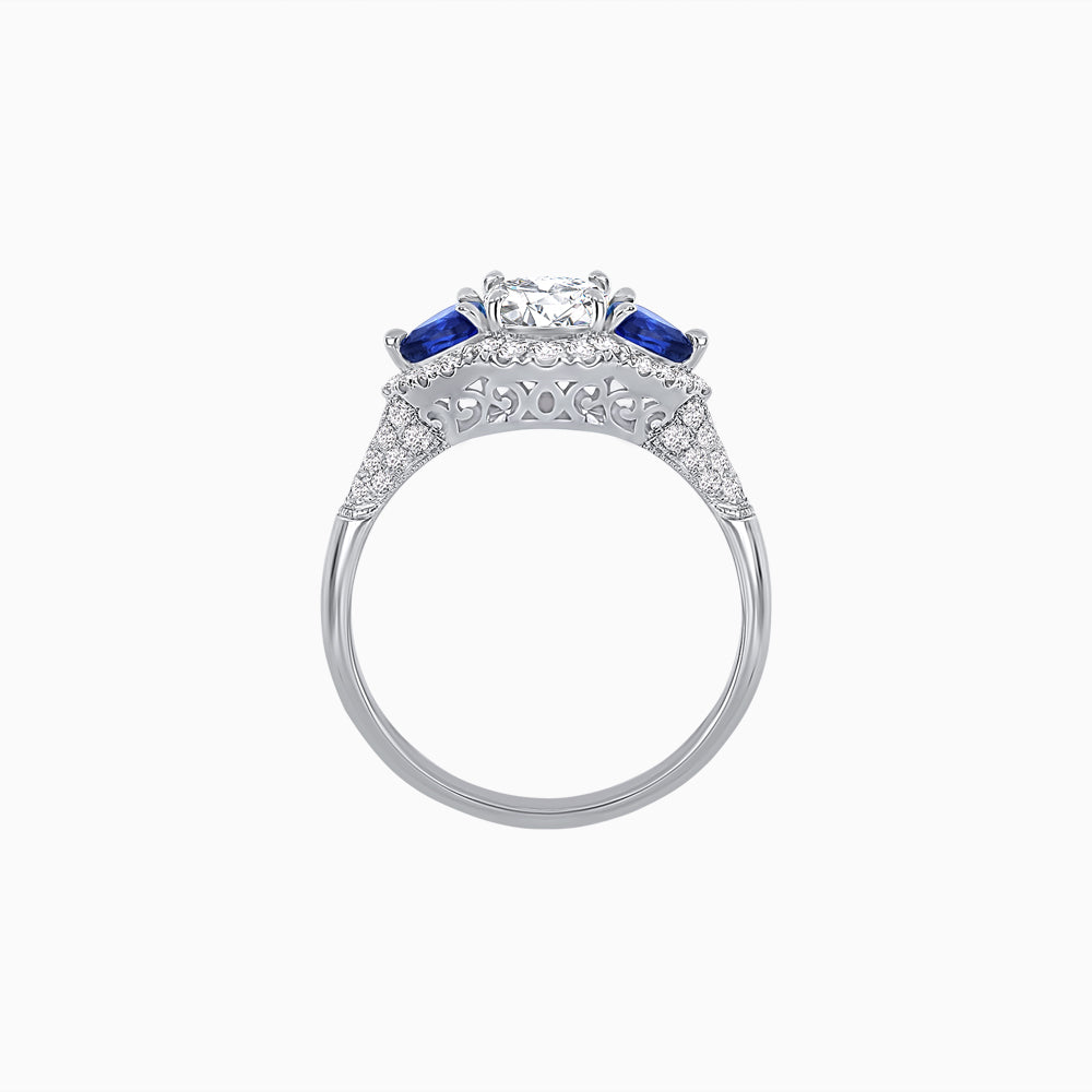 Three-Stone Oval Ring with Pear Shape Side Stones and Diamond Halo
