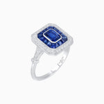 Load image into Gallery viewer, Art Deco Inspired Emerald Cut Halo Ring with Calibré Gems - Shahin Jewelry