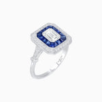 Load image into Gallery viewer, Art Deco Inspired Emerald Cut Halo Ring with Calibré Gems - Shahin Jewelry